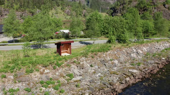 Small weather shelter made for salmon fishers along Norway salmon river at Dalekvam