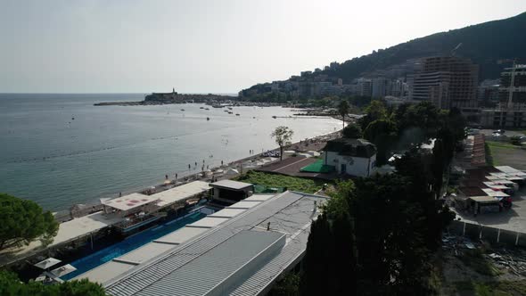 Aerial View Budva Beach By Sea with Sun Loungers and People Seashore Montenegro