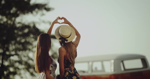 Young Two Women From 90 s in the Middle of Nature