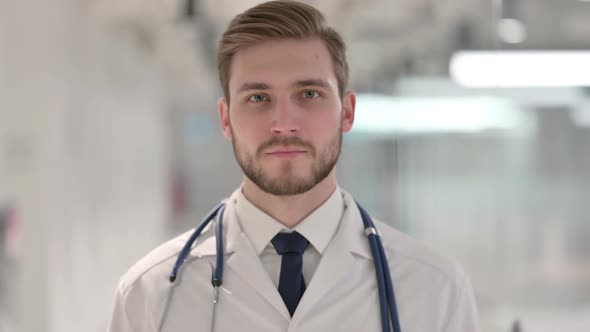 Young Male Doctor Looking at the Camera