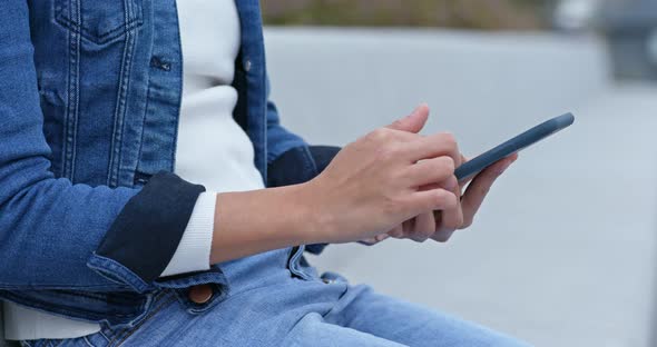 Woman hold with cellphone at outdoor