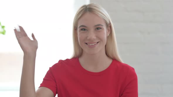 Young Blonde Woman Waving, Welcoming