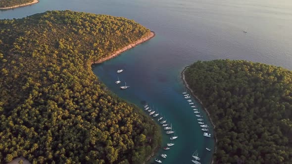 Aerial view of boats anchored at the shore of Krivica, Croatia.