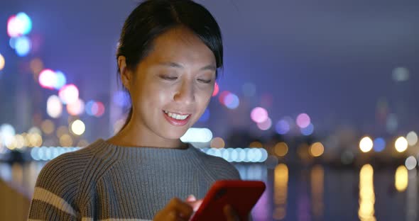 Asian Woman Use of Mobile Phone at Night