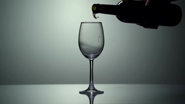 Closeup of Filling Wine Glass with White Wine in Super Slow Motion
