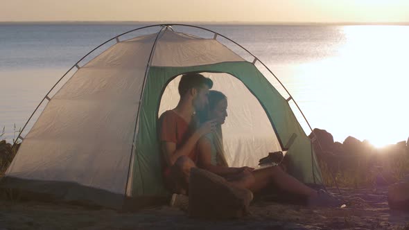 Couple Chats Online Via Skipe During Camping Trip