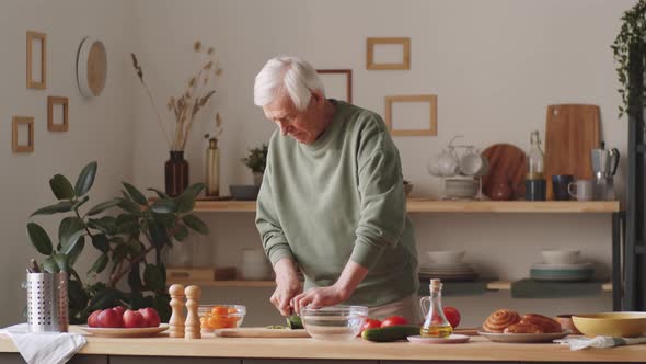 Senior Man Preparing Food at Home