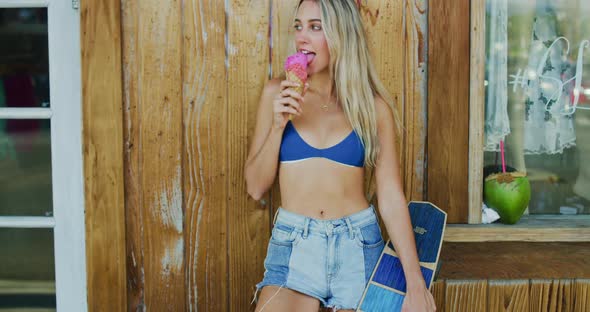 Attractive Young Woman Eating Ice Cream