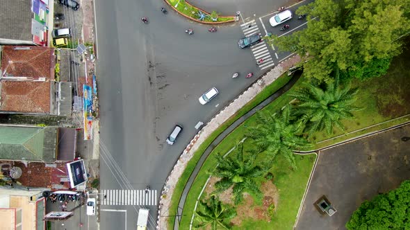Road traffic on Bayeman T junction in Magelang, Indonesia aerial top view