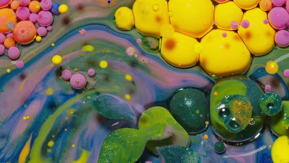 Yellow Neon Colorful Bubbles Oil and Ink Acrylic Paint Moving Closeup Wallpaper Background