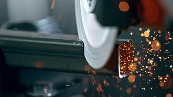 Super Slow Motion Detail Shot of Cutting Iron with Circular Saw at 1000 Fps.