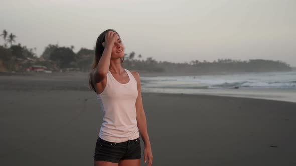 Happy Woman Enjoying Ocean View from Tropical Beach