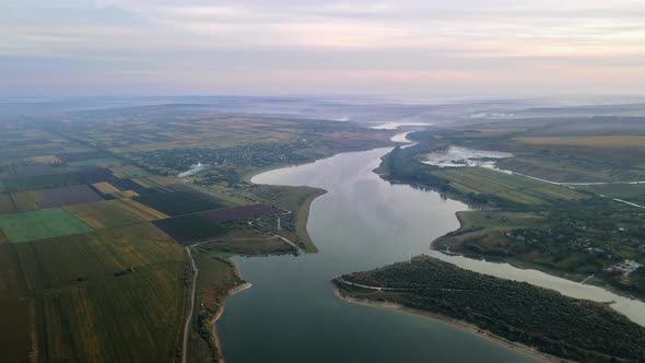 Aerial drone view of the Duruitoarea natural reservation in Moldova. River and fog in the air, hills