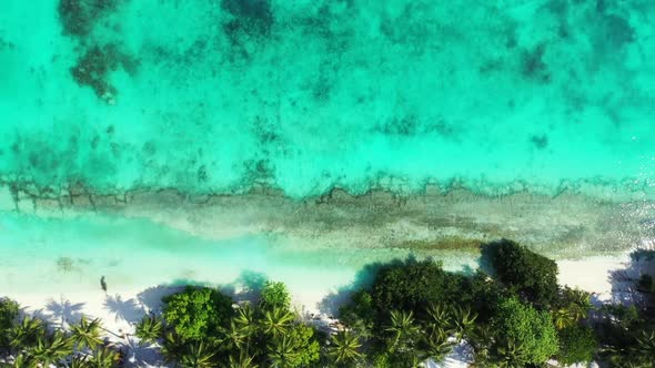 Aerial drone texture of tranquil shore beach holiday by blue ocean and white sand background of jour