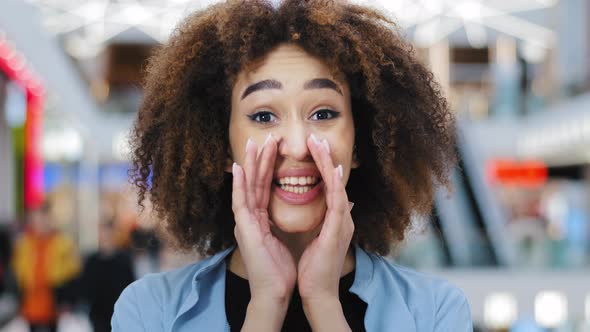 Mysterious African American Woman with Curly Hair Keeps Index Finger on Lips Tells Secret Makes