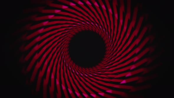 Red swirling moving tunnel on black background