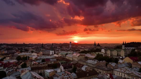 Aerial Hyperlapse Flying Above Cityscape Skyline in Lviv, Ukraine at Sunset