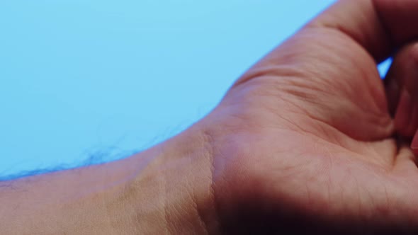 Hand Skin in Blue Neon Light Making Xray of Human Body Part Arm Surface Macro Shooting