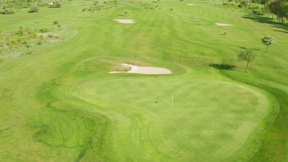 Large Green Area Prepared for Playing Golf Game in Summer