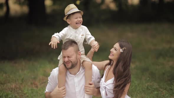 Young Caucasian Family with One Child Spend a Lot of Time Together and Have a Lot of Fun