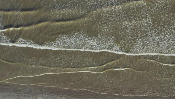 Aerial bird's eye drone view over Irish beach