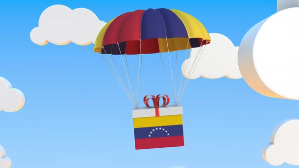 Box with National Flag of Venezuela Falls with a Parachute