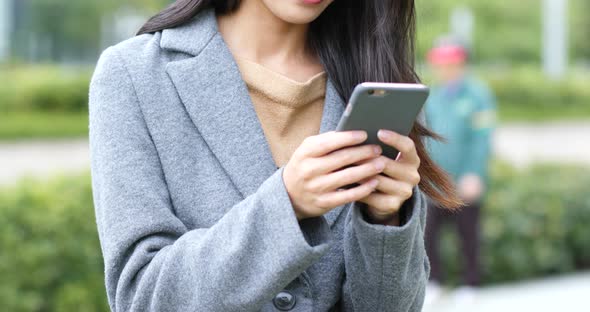 Woman use of smart phone in Hong Kong