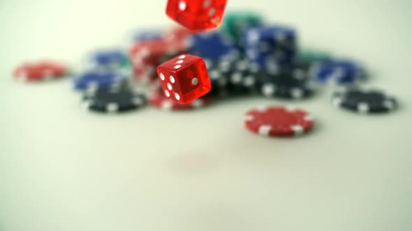 Throwing dice in front of casino chips, Slow Motion