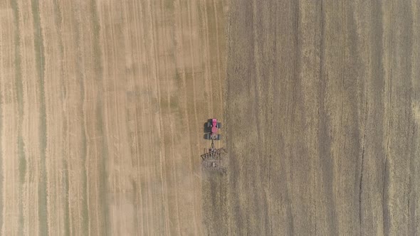 Aerial view of tractor plowing a field