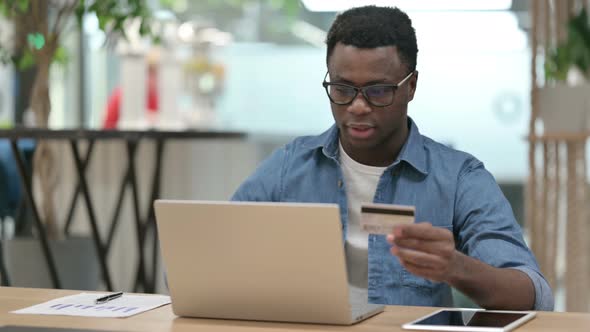 Online Shopping Payment Failure on Laptop By Young African Man