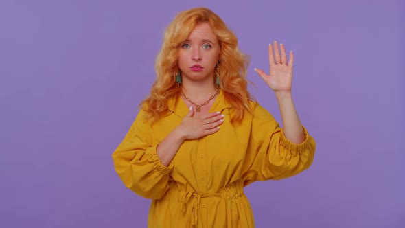 Sincere Responsible Redhead Girl Raising Hand to Take Oath Promising to Be Honest and to Tell Truth