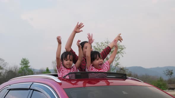 Happy family enjoying road trip on summer vacation.