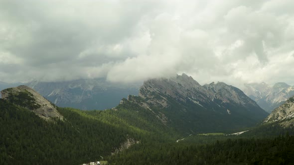 Rain clouds moving over beautiful mountain range in Dolomites, ITaly