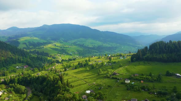 Aerial View of a Green Rural Area Under Blue Sky