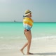 Barefoot Girl Walks On Sandy Beach Along Ocean - VideoHive Item for Sale
