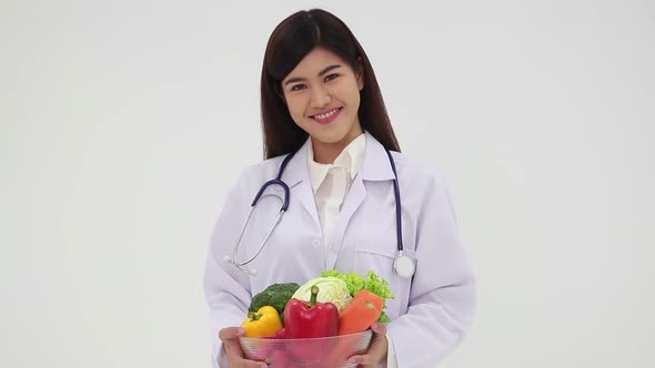 Asian female doctor or nutritionist have a beautiful smile wearing a white uniform