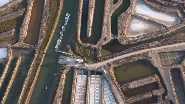 Aerial drone view of salt fields in Portugal. Sunset cinematic shot. Salt extraction