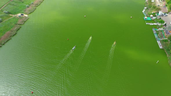 Aerial View of Competition Between the Teams on Rowing Boats on the Pond