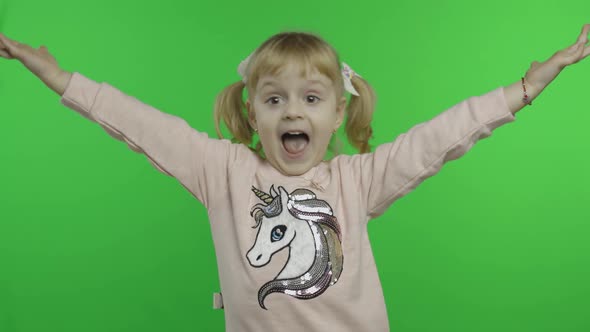 Girl in Unicorn Sweatshirt Dancing. Happy Four Years Old Child. Chroma Key