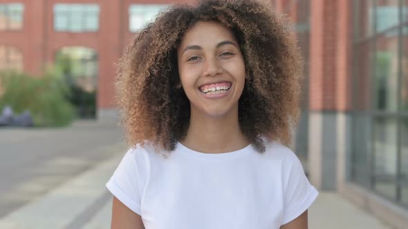 African Woman Smiling at Camera