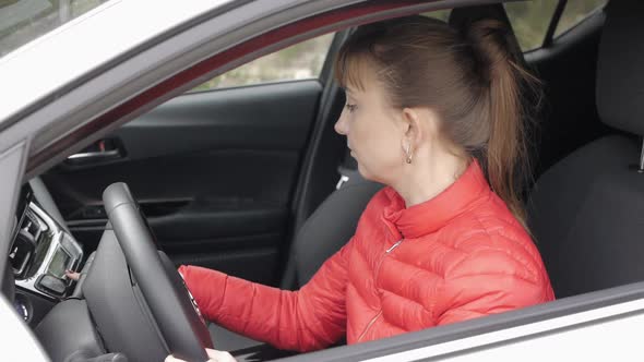 Woman Driver Sitting in the Car