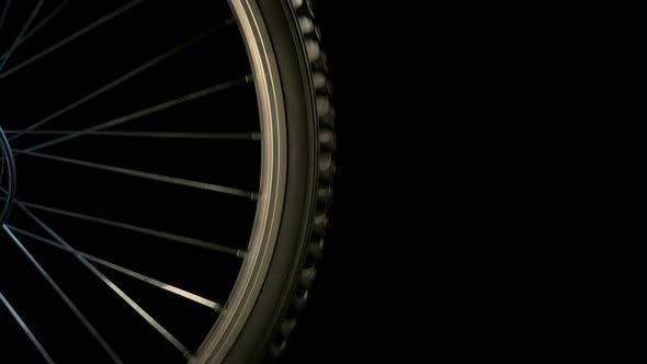 Bike Wheel Closeup With Flashing Car Lights At Night