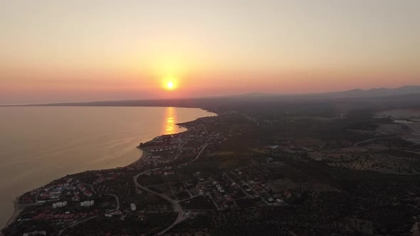 Flying Over Coastal Trikorfo Beach at Sunset, Greece