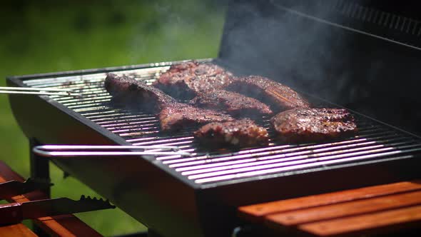 Tasty Ribs Cooking on Barbecue Grill for Summer Outdoor Party