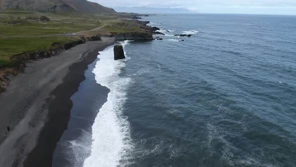 Drone view of black sand beach at Atlantic ocean in Iceland