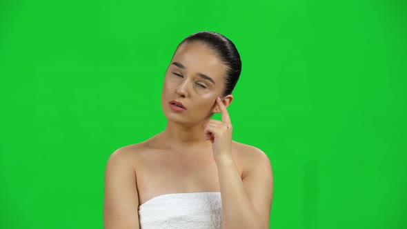 Young Girl Thinks About Something, and Then an Idea Comes To Her on Green Screen at Studio