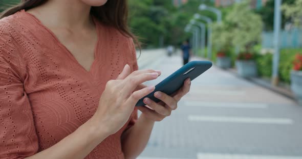 Woman talk to cellphone in the park