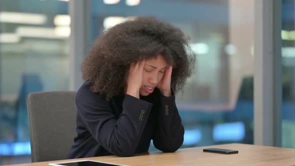 African Businesswoman Feeling Worried While Sitting in Office