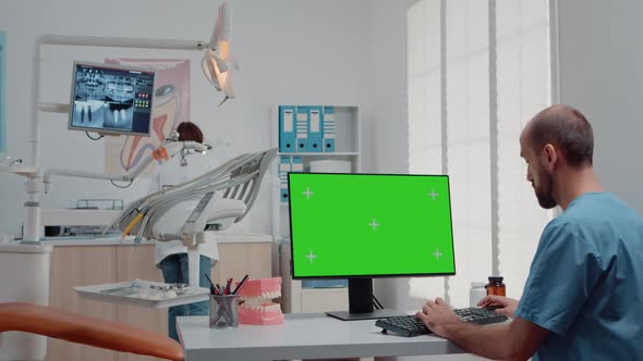 Man Using Monitor with Horizontal Green Screen