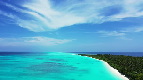 Aerial drone sky of perfect coastline beach vacation by transparent lagoon and white sandy backgroun